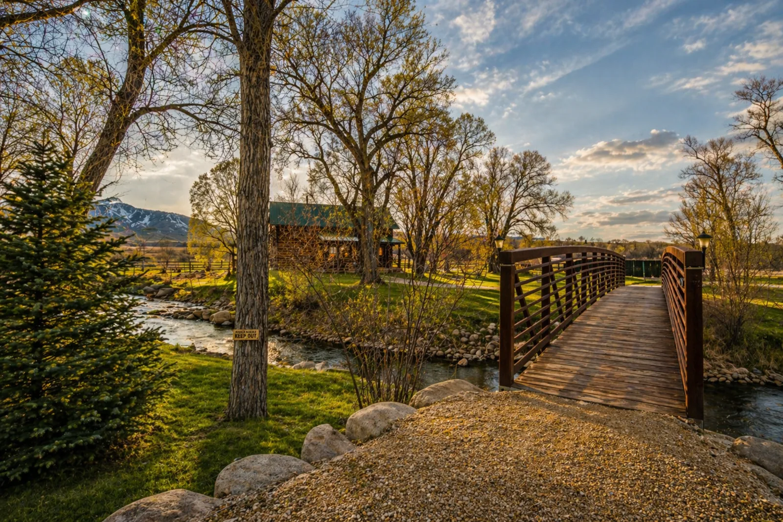 Private footbridge over Clear Creek to log cabin Buffalo Wyoming