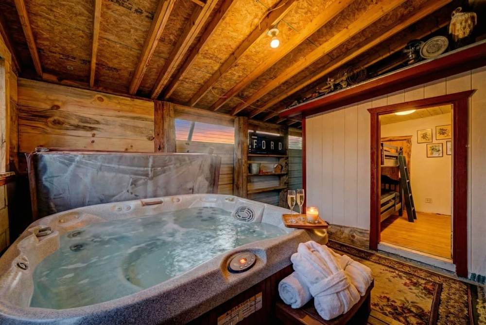 Private indoor hot tub in the garage lounge